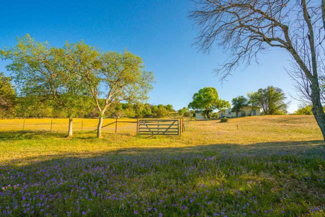 View of yard featuring a rural view and fence | Image 22