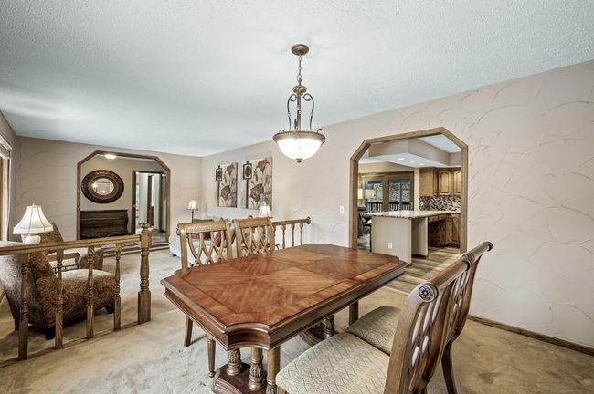 The dining room opens up into the kitchen and other main floor family room | Image 11