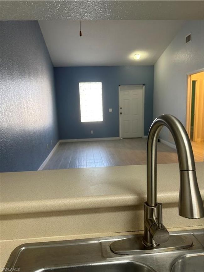 Room details with hardwood / wood-style floors and sink | Image 9