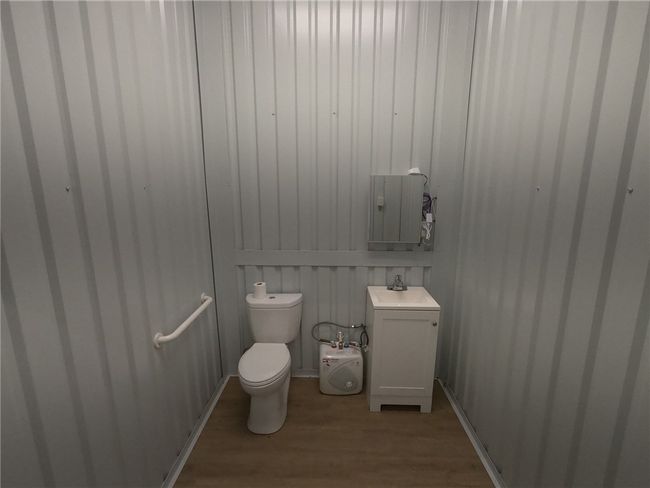 Bathroom featuring a sink and wood finished floors | Image 11