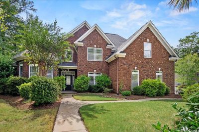 View of front of home with a front lawn | Image 1