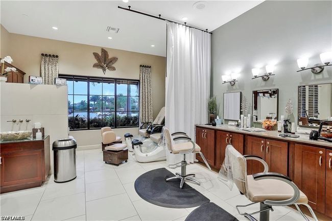 Full bath featuring vanity, a bathtub, tile patterned flooring, and recessed lighting | Image 40