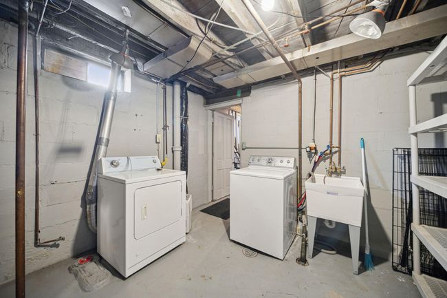 Lower level laundry room with utility sink | Image 19