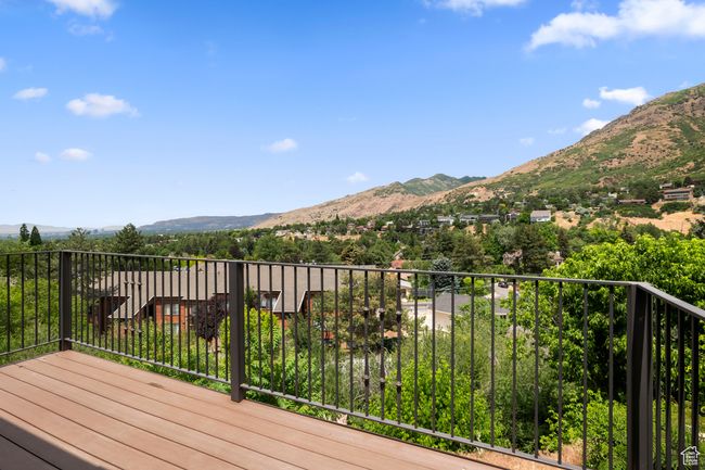 Wooden terrace featuring a mountain view | Image 5