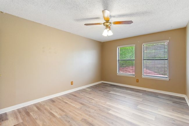 3rd bedroom with ceiling fan, new plank floors and ceililng fan | Image 16