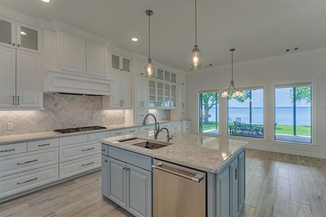 A whole-home water filtration system, along with a secondary filter beneath the kitchen sink, ensures that all water entering the home is clean, fresh, and safe for everyday use. | Image 17