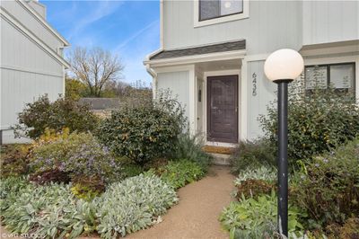 Lush landscaping along the front walk to the home. | Image 2