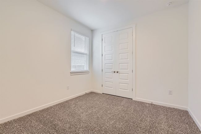 Carpeted spare room featuring baseboards | Image 19