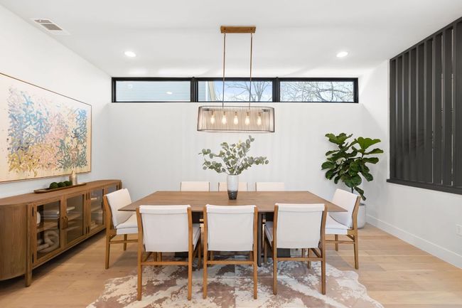 Dining space with recessed lighting, light wood-style floors, visible vents, and baseboards | Image 15