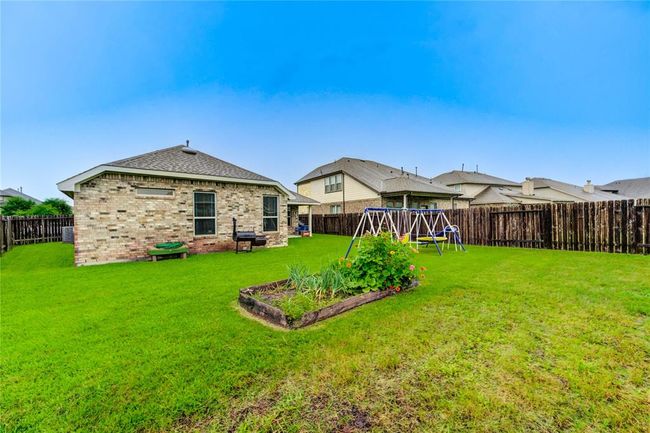 Large fully fenced back yard with plenty of room for a garden or a pool! | Image 37