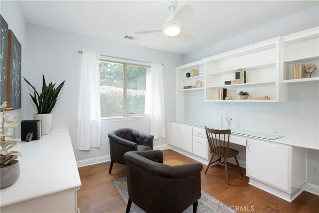 Office with 2 twin built-in desks and bookshelves | Image 43