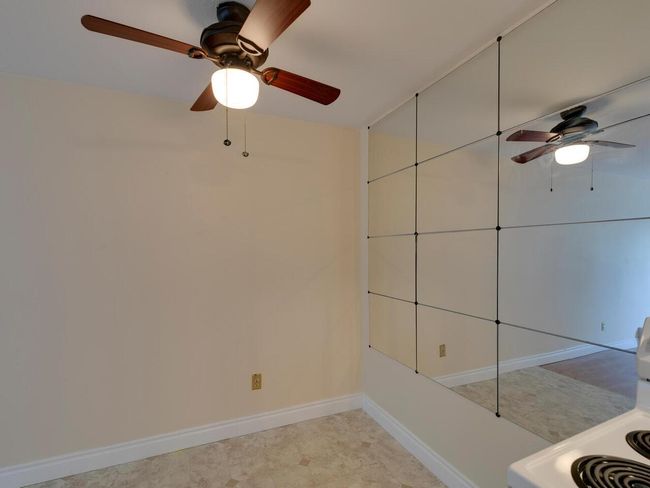 Empty room with baseboards and a ceiling fan | Image 11