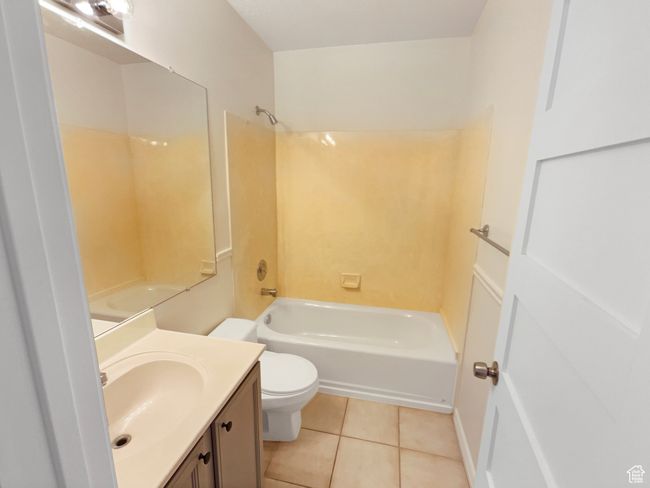 Full bath with vanity, toilet, tile patterned flooring, and bathing tub / shower combination | Image 17