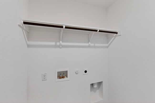 Laundry area featuring electric dryer hookup, hookup for a gas dryer, and hookup for a washing machine | Image 32