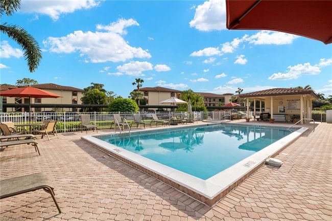 View of swimming pool with a patio | Image 24