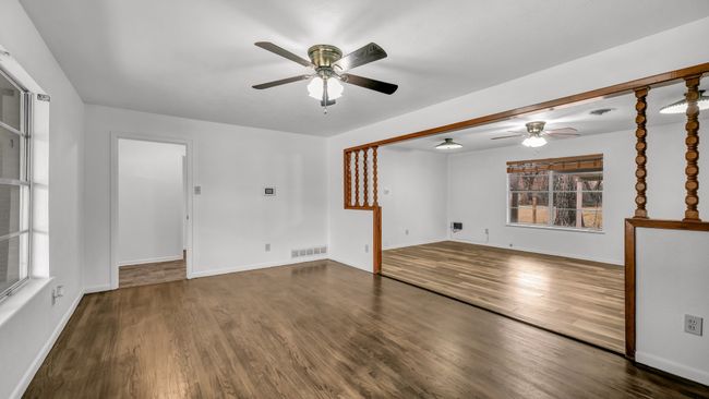 Family room with ceiling fan and new luxury vinyl plank flooring | Image 8