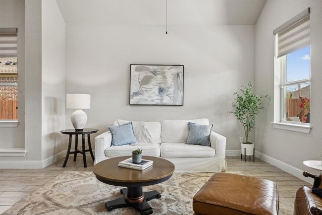 Living room with wood finished floors and baseboards | Image 14