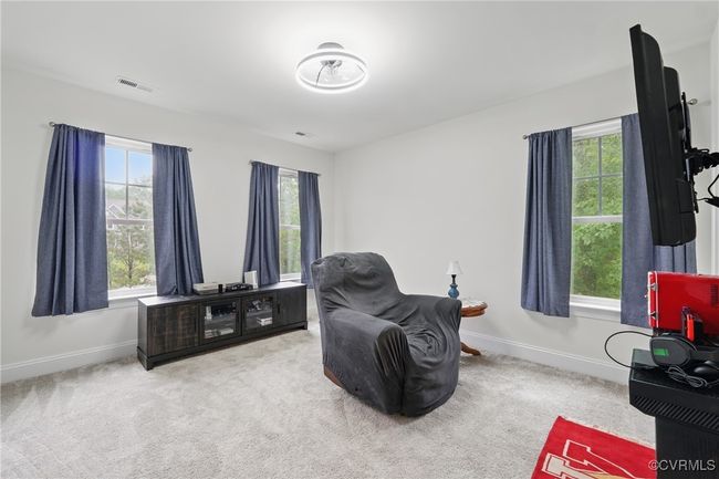 Spacious bedroom with ample natural light | Image 27