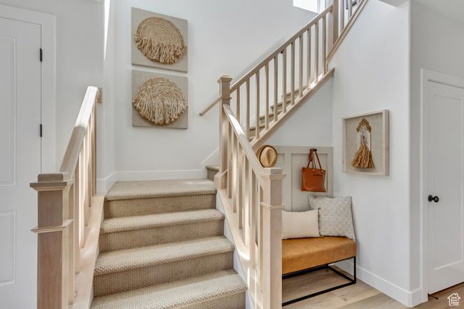 Staircase featuring baseboards and wood finished floors | Image 25