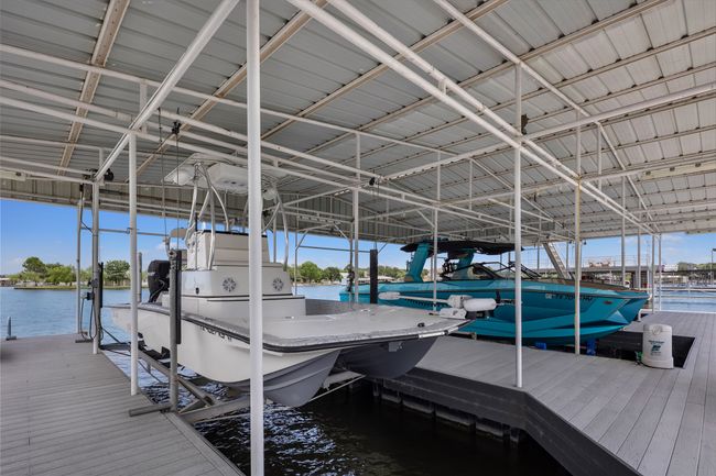 Dock featuring a water view and boat lift | Image 27