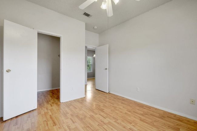 View from second bedroom into spacious walk-in closet and towards the dining area. | Image 19