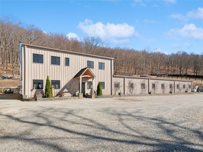 Overbuilt barn to withstand hurricane force winds and snow loads and equipped with gutter guards to mitigate maintenance | Image 25