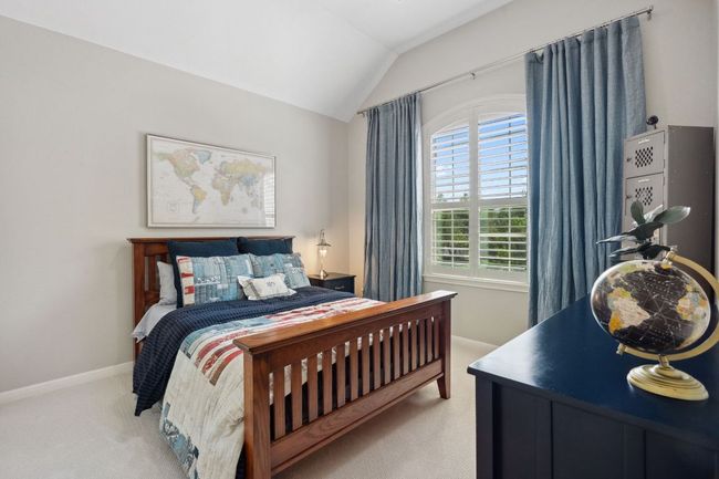 The other secondary bedroom offers plush Tempurpedic carpeting and vaulted ceilings. | Image 27