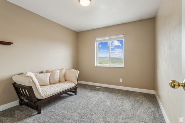 Sitting room with carpet floors and baseboards | Image 10
