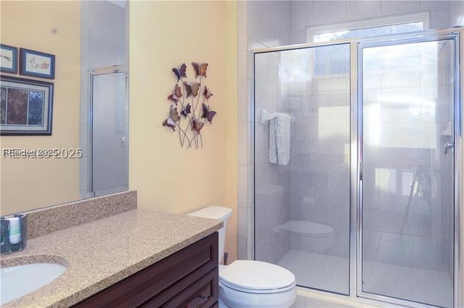 The main bathroom is in the hallway adjacent to the rear Bedroom #3 being used as an office and den. | Image 44