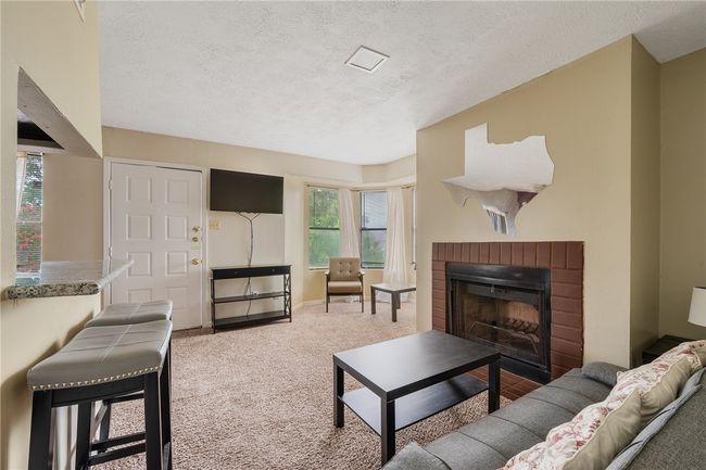 Living area reverse view - TV with remote | Image 7