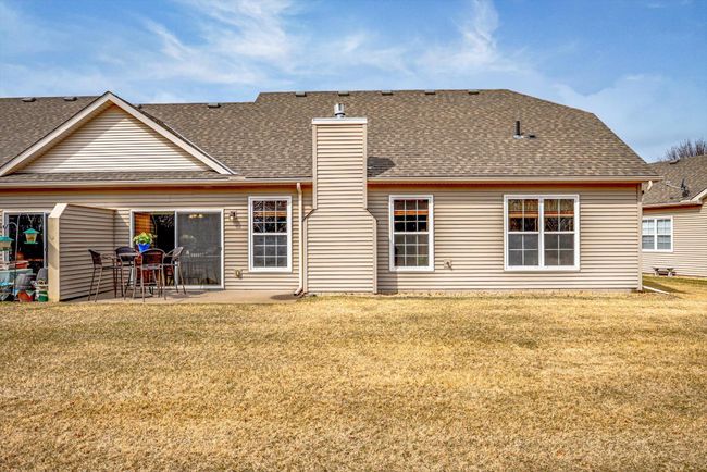 Enjoy a peaceful outdoor setting with a private patio and green space—perfect for relaxing or light gardening. | Image 36