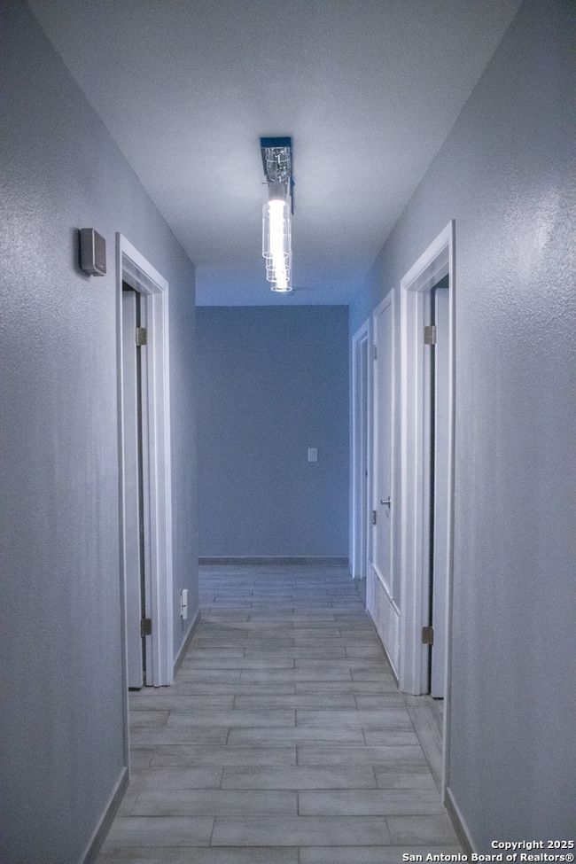 Hallway to bedrooms and half bath | Image 12