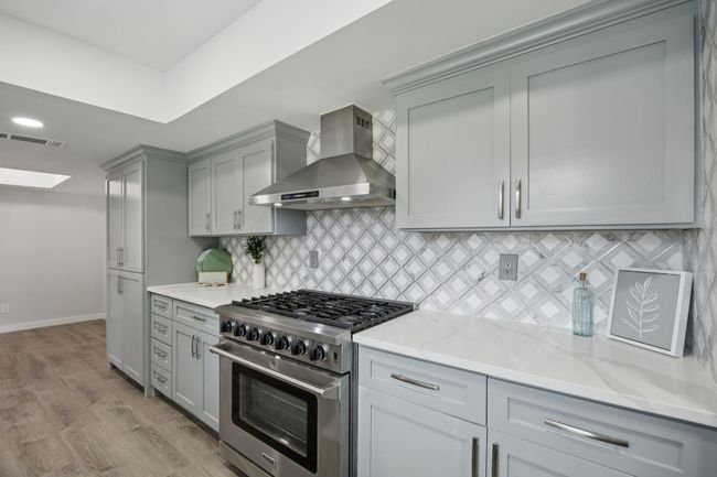HUGE Built in Pantry - Loads of Cabinets and Drawers (soft closing), AND don't miss the Commercial Grade Gas Oven and SIX Burner Gas Cooktop. | Image 16