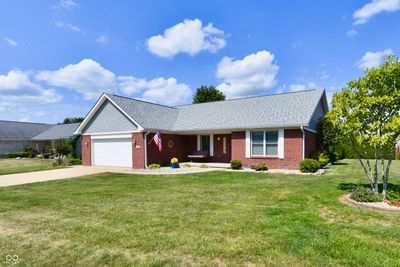 Beautiful brick home on corner lot with large yard and mature landscaping. Curb appeal! | Image 1