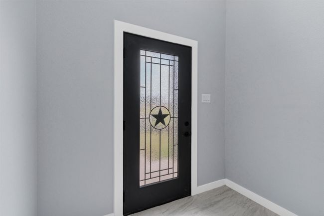 Foyer with baseboards and light marble finish floors | Image 5