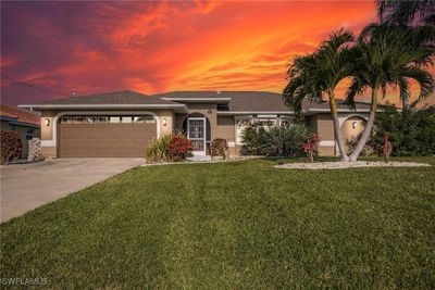 View of front facade featuring a yard and a garage | Image 3