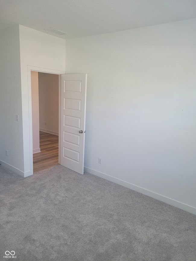 unfurnished room featuring baseboards and carpet | Image 14