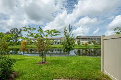 The community beautiful water view with lush landscaping. | Image 2