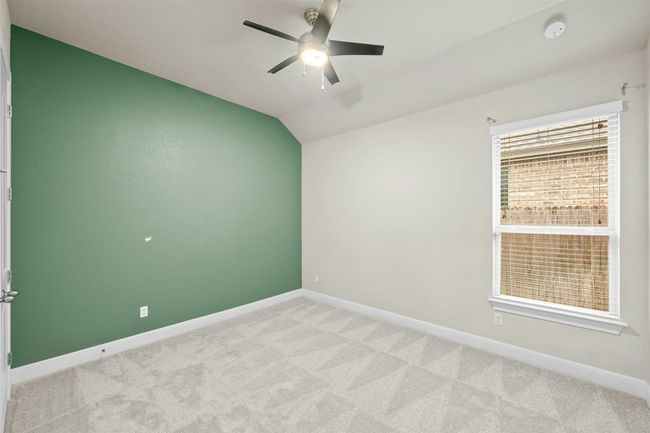 Two additional secondary bedrooms provide flexibility for family members, guests, or a home office. | Image 23