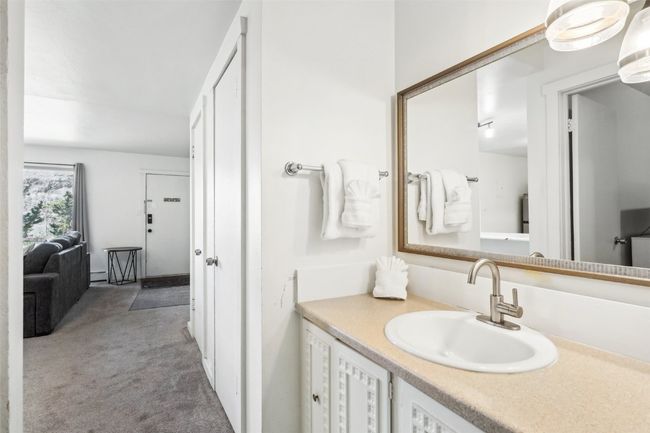 Bathroom featuring a baseboard radiator and vanity | Image 18