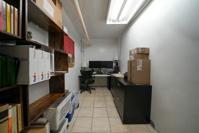 Office featuring light tile patterned floors | Image 10