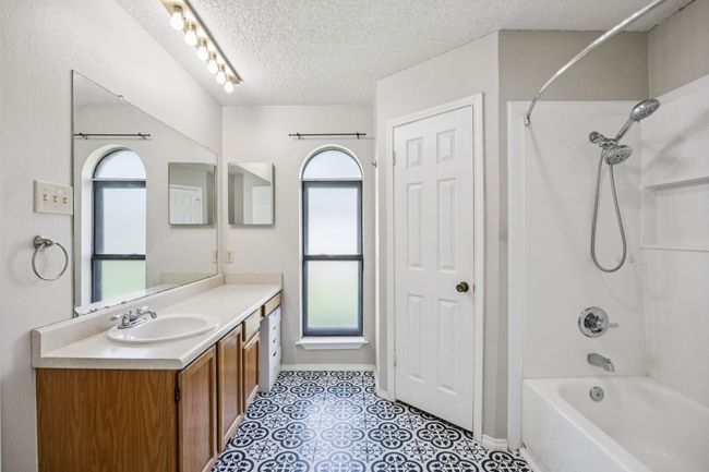 Primary ensuite bathroom with a large vanity that provides great storage | Image 14
