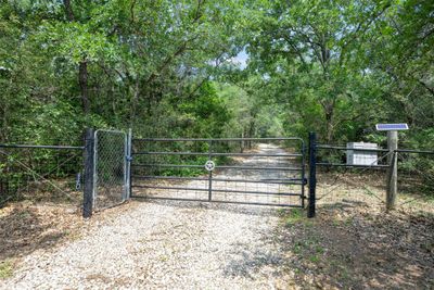 Remote control gate leading into a beautiful, private piece of tranquility. | Image 2