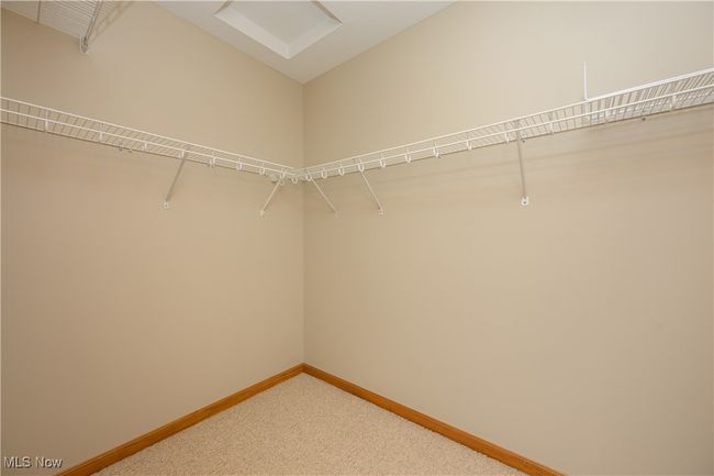 Spacious closet featuring carpet floors | Image 15