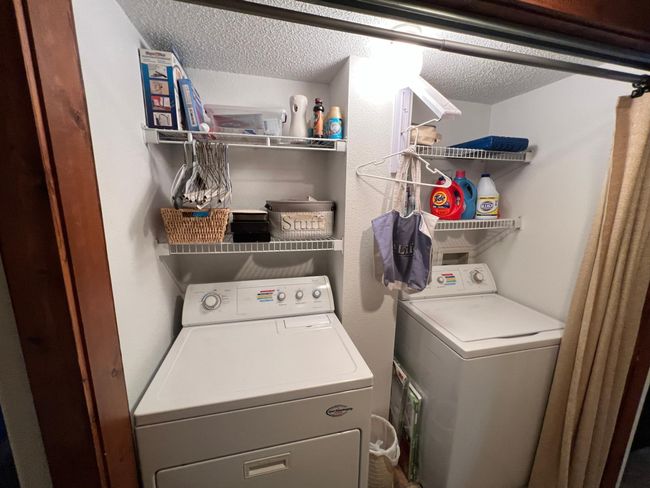 Laundry area conveniently located between bedrooms and kitchen | Image 36