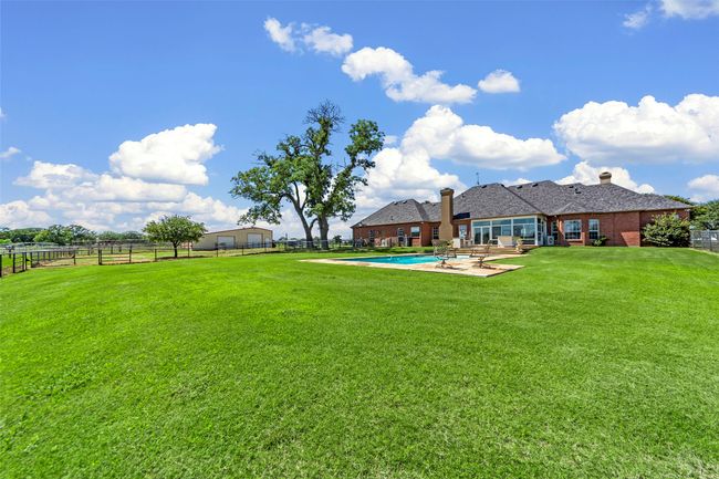 BACK OF HOME...Huge Fenced Back Yard For Pets, Plus Smaller Fenced Yard To Keep Pets Away From Pool | Image 9