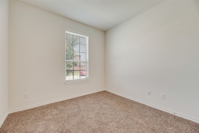 Carpeted empty room with baseboards | Image 26