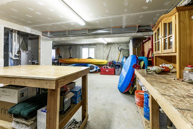 Garage with a workshop area | Image 26