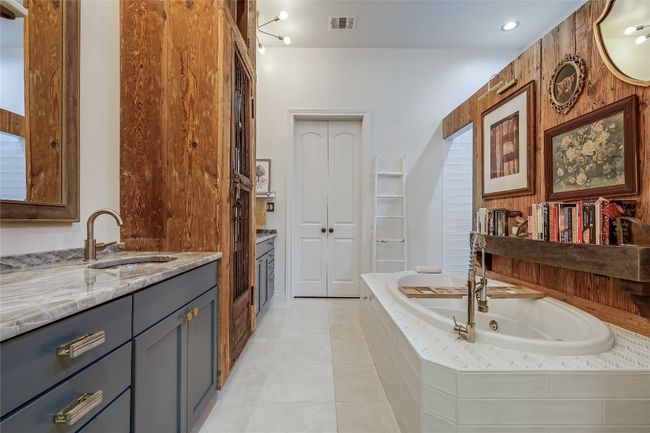 Full bathroom featuring vanity, tile patterned flooring, visible vents, and a whirlpool tub | Image 29