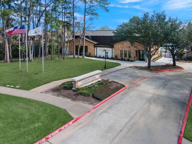 Situated in the amenity-rich Spring Trails community, this inviting clubhouse offers residents access to a refreshing pool, fitness center, and sports courts. The beautifully landscaped surroundings provide an ideal backdrop for gatherings and relaxation, enhancing the neighborhood's appeal. | Image 40